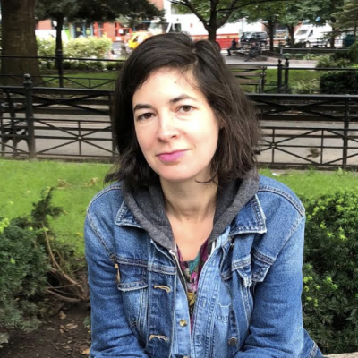 Elana Gordon A woman with a jean jacket posses for a photo.