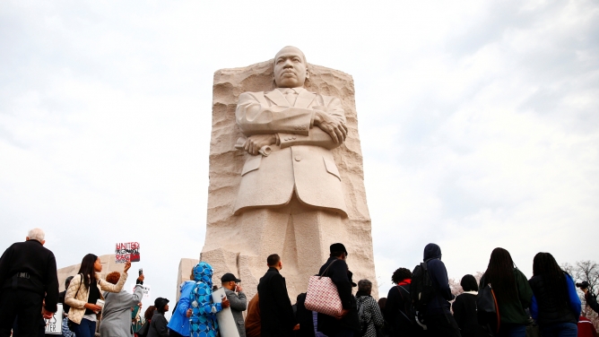 People walk around the monument of Rev. Martin Luther King Jr. in Washington.