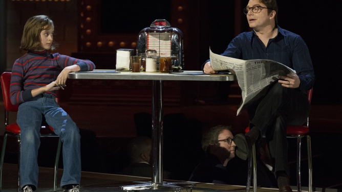 Sydney Lucas (L) performs a scene from "Fun Home" with a cast member during the Tony Awards in New York June 7, 2015.