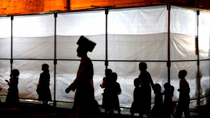 the silhouettes of members of the ultra orthodox community in Jerusalem