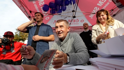 The leader of ANO party Andrej Babis signs books for a supporter during an election campaign rally in Prague, Czech Republic September 28, 2017.