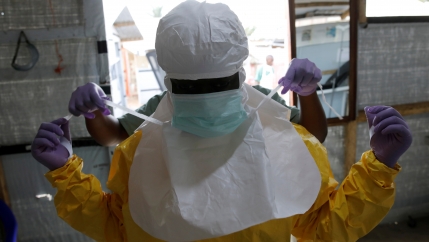 A person wears protective gear on face and body