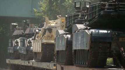 tanks on rail cars waiting for a parade in washington, dc