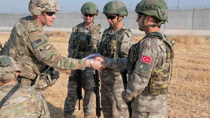 US and Turkish military forces conduct a joint ground patrol inside the security mechanism area in northeast, Syria, October 4, 2019.