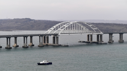 An aerial view shows a road-and-rail bridge