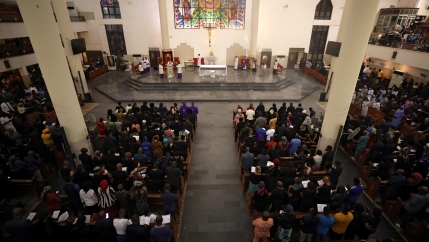People attend Ash Wednesday mass in a church in Abuja, Nigeria, Feb. 26, 2020.