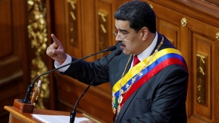Venezuela's disputed President Nicolas Maduro gestures as he speaks during a special session of the National Constituent Assembly to deliver his annual state of the nation speech, in Caracas, Venezuela, Jan. 14, 2020.