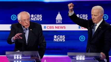 Democratic 2020 US presidential candidates Sen. Bernie Sanders and former Vice President Joe Biden participate in the tenth Democratic 2020 presidential debate at the Gaillard Center in Charleston, South Carolina, Feb. 25, 2020.