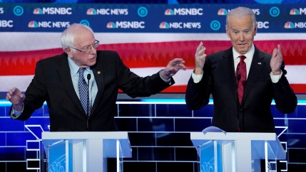 Senator Bernie Sanders speaks as former Vice President Joe Biden reacts during the ninth Democratic 2020 U.S. Presidential candidates debate at the Paris Theater in Las Vegas Nevada, on Feb. 19, 2020.