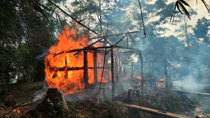 Houses are on fire in Gawdu Zara village, northern Rakhine state, Myanmar, Sept. 7, 2017.