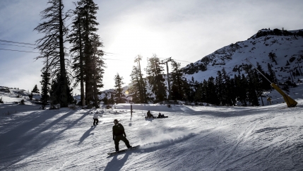 A snowboarder heads back to the lodge at Squaw Valley in Olympic Valley, California, Dec. 5, 2015. Last month, the resort announced plans to change its name in the coming year.