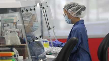 A technician works in the lab at Visby Medical, makers of a new COVID-19 test kit, in San Jose, Calif., Aug. 28, 2020. 