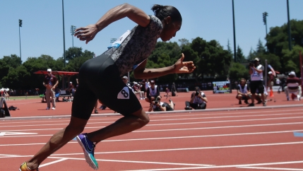 Caster Semenya wears a track and field outfit and sets off on a race