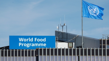 The World Food Program's flag flutters on the roof of WFP headquaters after the organization won the 2020 Nobel Peace Prize, in Rome, Italy, Oct. 9, 2020.