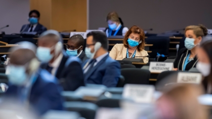 Delegates, wearing masks, listen to speeches during the 45th session of the Human Rights Council, at the European UN headquarters in Geneva, Sept. 14, 2020. 