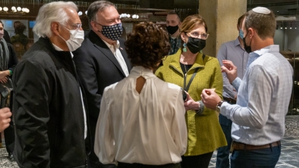 In this photo posted on US Secretary of State's Twitter account, Mike Pompeo, center, and the US ambassador to Israel, David Friedman, left, meet with the managers of the Psagot winery in the West Bank.  