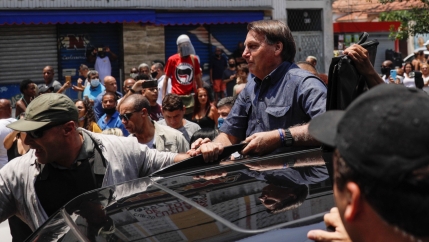 Brazil's President Jair Bolsonaro leaves after he voted during the municipal elections in Rio de Janeiro, Nov. 15, 2020. 