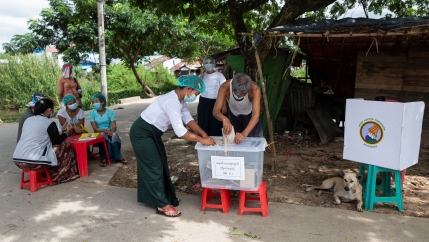 A man cast his ballot during the early voting ahead of the Nov. 8 general election, amid the coronavirus disease (COVID-19) spread in Yangon, Myanmar, Oct. 30, 2020. 