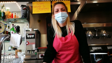 Bar owner Cristina Mattioli put up a sign asking patrons not to talk about COVID-19.