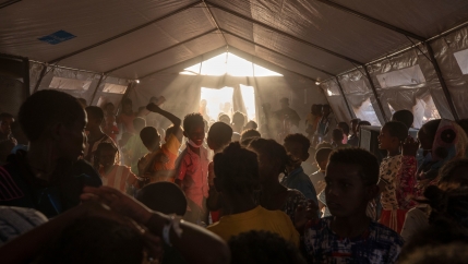 Tigray refugee children sing and dance inside a tent run by UNICEF for children's activities, in Umm Rakouba refugee camp in Qadarif, eastern Sudan, Thursday, Dec. 10, 2020.