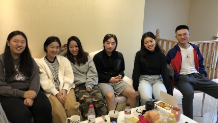 Emily Mao, second from left, joined a co-living community of students in Hangzhou, China, who are studying online — often overnight — at US and Canada-based colleges and universities.