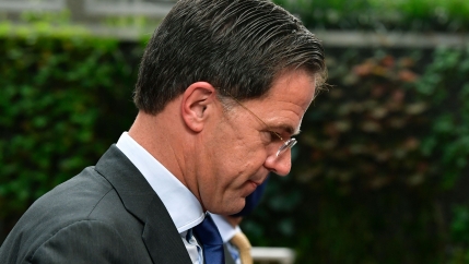 Netherlands' Prime Minister Mark Rutte is shown in a close-up photograph wearing a gray suit and looking down.