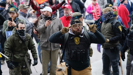 An angry mob storms the US Capitol building. 