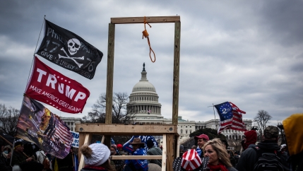 Crowds carrying hate symbols as they stormed the U.S Capitol on Jan. 6 in Washington, D.C. 