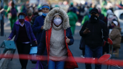 Residents of the Iztacalco borough follow a long, snaking line to receive doses of the Russian COVID-19 vaccine Sputnik V, during a mass vaccination campaign for Mexicans over age 60, at the Advanced School for Physical Education, in Mexico City, Feb. 24,