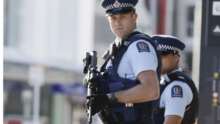 Police officers carry heavy, black guns. 