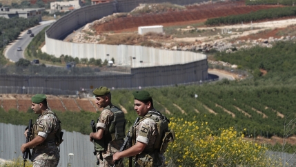 Lebanese army soldiers deploy on Lebanon's side of the Lebanese-Israeli border in the southern village of Kfar Kila