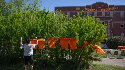 Attendees perform a round dance during a press conference and prayer vigil at the former Muscowequan Indian Residential School, one of the last residential schools to close its doors in Canada in 1997 and the last fully intact residential school still sta