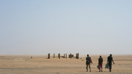 Three men head north toward Algeria after crossing the Assamaka border post in northern Niger, June 3, 2018.