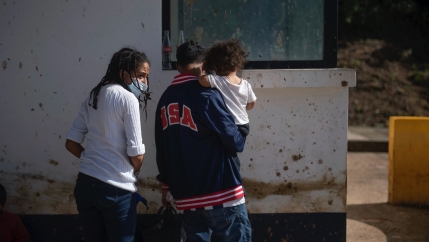 Honduran migrants Bianca Emerita Galvan, 22, left, and Dani Omar Suazo, 21, holding their son 1-year-old sone Daniel Emir, arrive at El Ceibo, Guatemala, Aug. 12, 2021, after being deported by air from the US to Mexico and then shipped into Guatemala by l