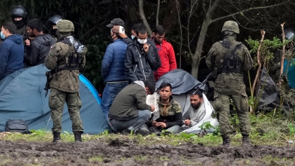 Polish security forces surround migrants stuck along with border with Belarus in Usnarz Gorny, Poland, on Wednesday, Sept. 1, 2021. 