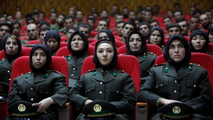 Newly trained female officers from the Afghan National Army sit in front seats as a new batch of officers attend their graduation ceremony at National Army's training center in Kabul on Sept. 23, 2010. 