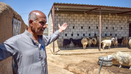 Yassin, a farmer from al-Sebat village in Rural Hasakah, stands in the yard where he keeps his livestock while explaining the catastrophic effects of drought on his life. 