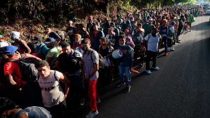 A caravan of migrants head north towards the US-Mexico border, as they depart from Tapachula, Mexico
