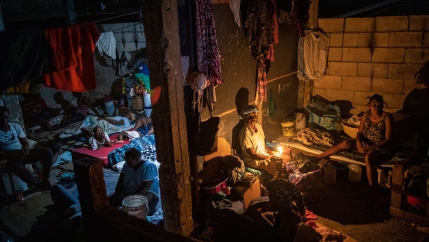 People displaced by gang violence occupy a school turned into a long-term shelter, in Port-au-Prince, Haiti, Thursday, Sept. 16, 2021.