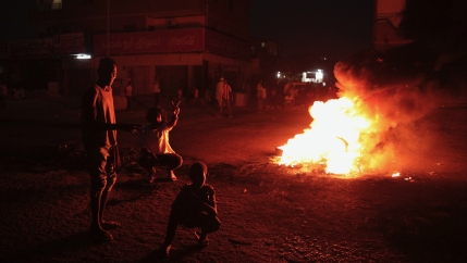 People protest in Khartoum, Sudan, two days after a military coup, Oct. 27, 2021. The coup threatens to halt Sudan's fitful transition to democracy, which began after the 2019 ouster of longtime ruler Omar al-Bashir and his Islamist government in a popula