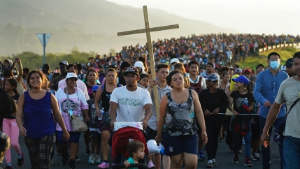 Migrants leave Huixtla, Chiapas state, Mexico, early Oct. 27, 2021, as they continue their trek north toward Mexico's northern states and the US border.