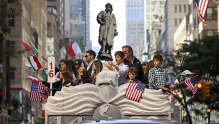 Italian Americans celebrating during a Christopher Columbus Day parade. 