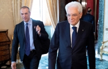 Carlo Cottarelli arrives for a meeting with the Italian President Sergio Mattarella walk next to each other