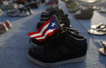 Shoes at Puerto Rico's capitol building represent the more 4,645 deaths attributed to Hurricane Maria