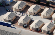 an aerial view of a tent camp for detained migrant children in the US