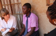 Author Anna Dahlqvist talking with Saudah, a teenager in Kampala, Uganda
