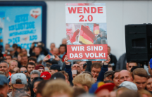 a protest in east germany with lots of people