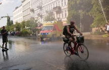 Firefighters blast water in Berlin in mid-August, providing relief from the heat. This is among the few ways to cool off in a city with little air conditioning.