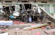 Boys inspect the wreckage of a bus at the scene of Thursday's air strike in Saada province, Yemen August 10, 2018.