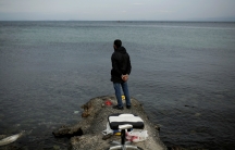 Syrian refugee Muhammad, 42, looks at the sea while fishing in the city of Mytilene, on the island of Lesbos, Greece, Dec. 2, 2017.